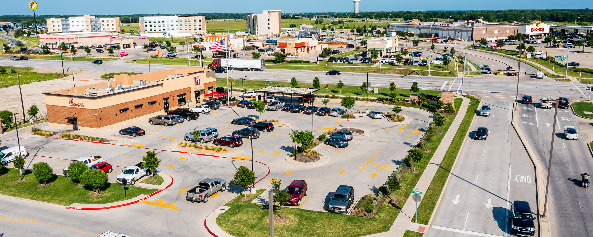 Aerial view of Chick-fil-A with Bucces in the background